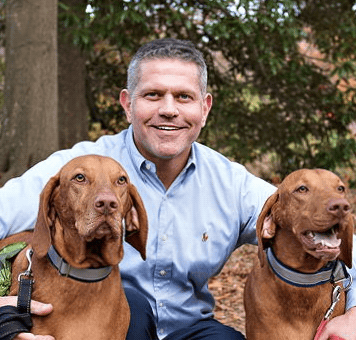 Atlanta REALTOR Kevin Harden with his Vizslas Otis and Amos