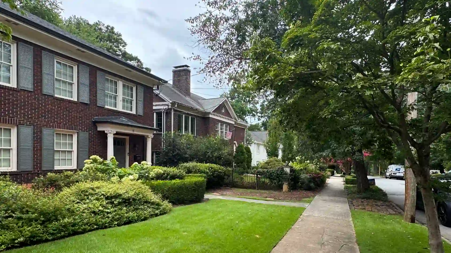 Brick homes along tree-lined 25th Street in Ardmore Park and Brookwood, Atlanta